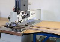 Joining veneer splices on a Kuper machine